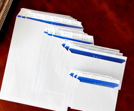 Koperty białe C6 HK Delux 114x162mm poddruk granatowy 120g 25 szt.